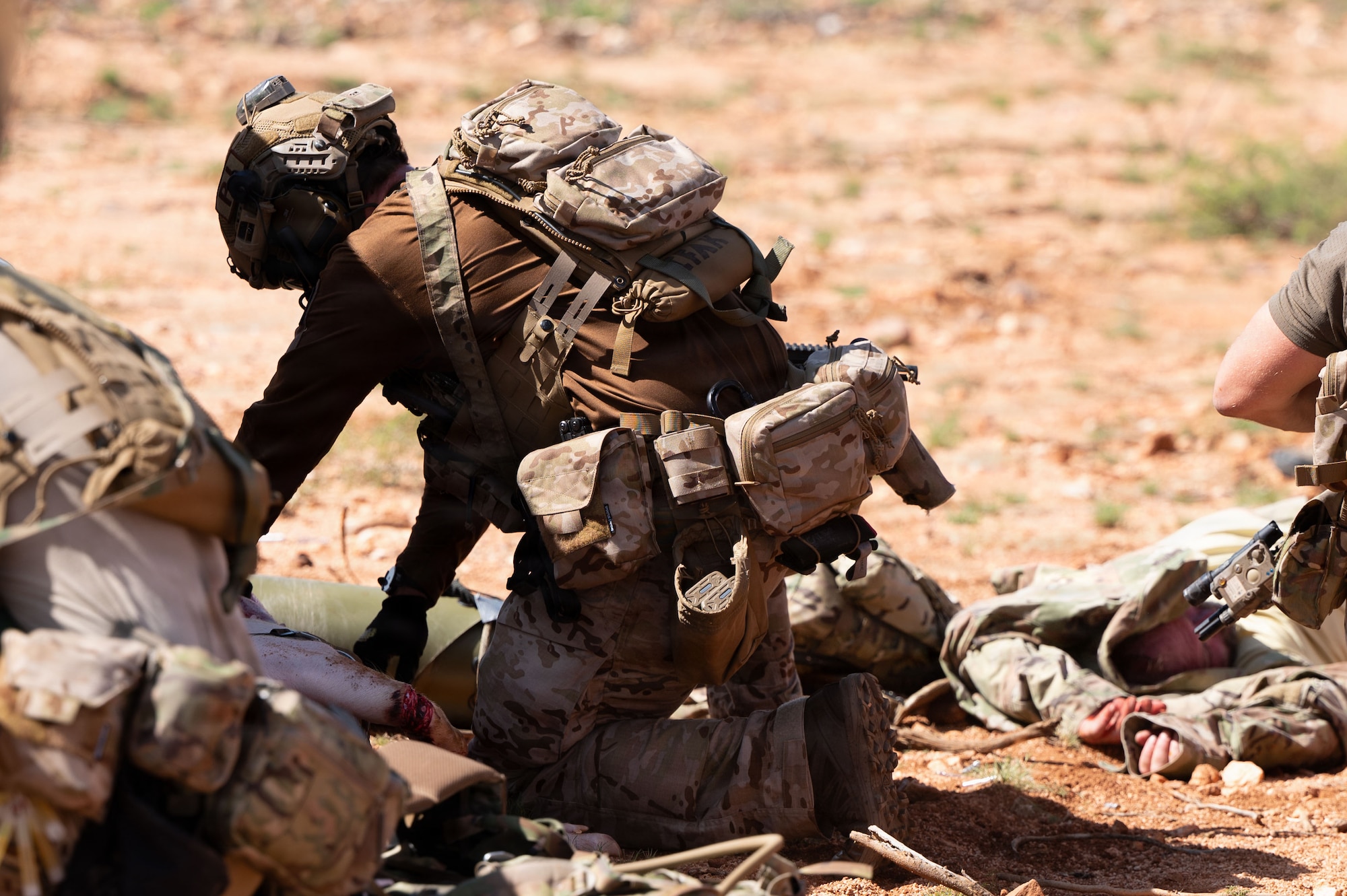 A U.S. Air Force pararescueman assigned to the 38th Rescue Squadron provides medical aid to a patient during exercise Operation Iron Covenant. Pararescuemen are able to adapt to changing situations while maintaining mission focus and operational readiness. (U.S. Air Force photo by Airman Najzee Kuzu)