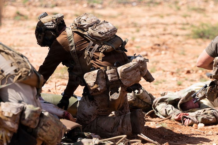 A U.S. Air Force pararescueman assigned to the 38th Rescue Squadron provides medical aid to a patient during exercise Operation Iron Covenant. Pararescuemen are able to adapt to changing situations while maintaining mission focus and operational readiness. (U.S. Air Force photo by Airman Najzee Kuzu)