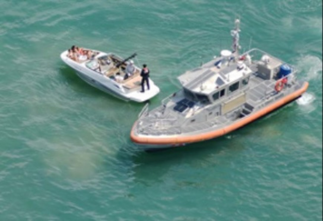 A Coast Guard 45-foot Response Boat-Medium crew boards a recreational boat in support of Operation Safe Water in the Chicago Playpen in Chicago, Illinois, July 25, 2026. The purpose of Coast Guard vessel boardings is to enforce U.S. laws and regulations, promote marine safety, ensure national security and protect the marine environment. (U.S. Coast Guard photo, courtesy Marine Safety Unit Chicago)