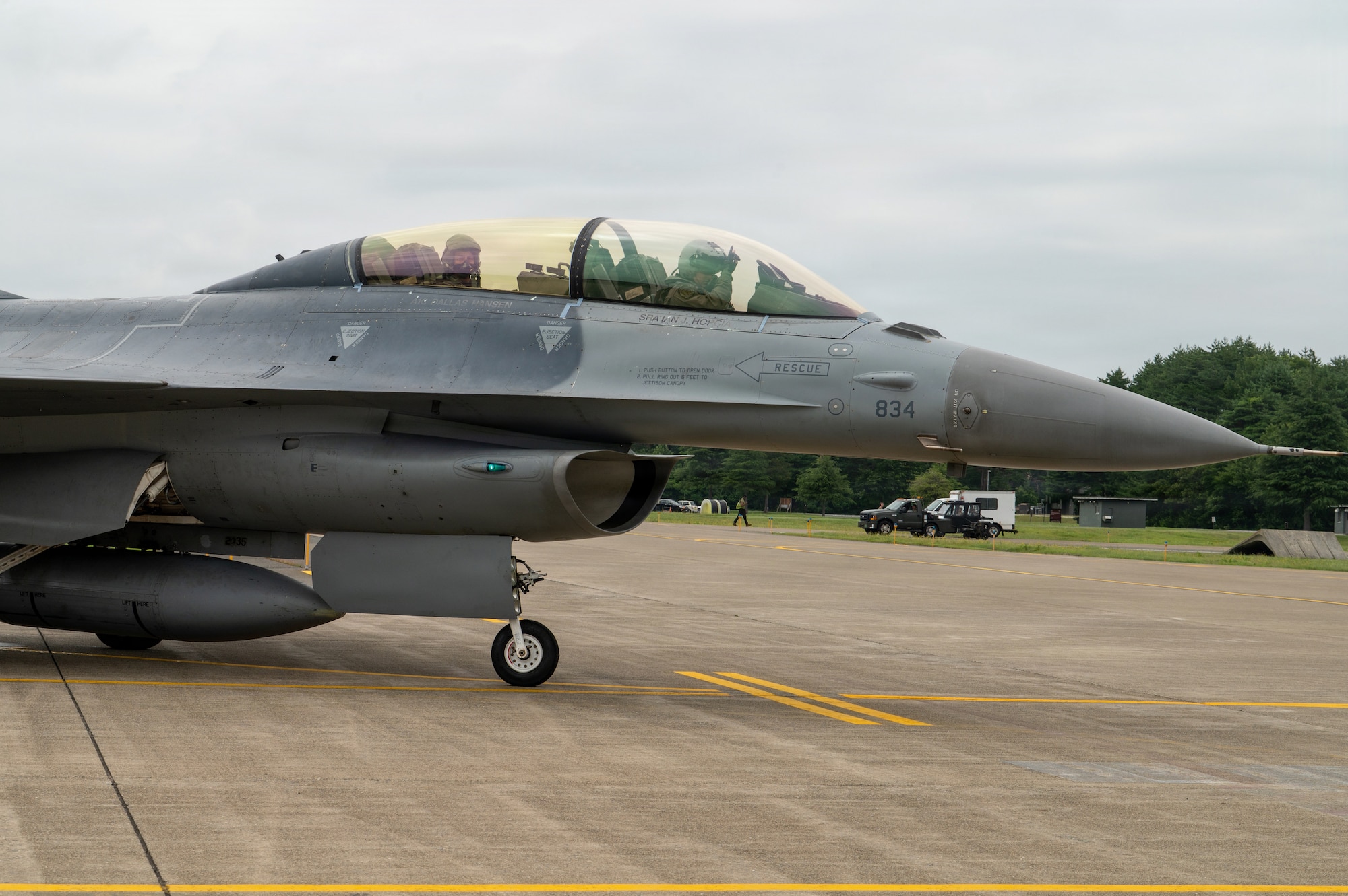 U.S. Air Force Col. Jeromy Guinther, 35th Operations Group commander, and Japan Air Self-Defense Force Lt. Gen. Keita Funakura, Northern Air Defense Force commander, complete preflight checks on a USAF F-16 Fighting Falcon before a familiarization flight at Misawa Air Base, Japan, July 27, 2026.