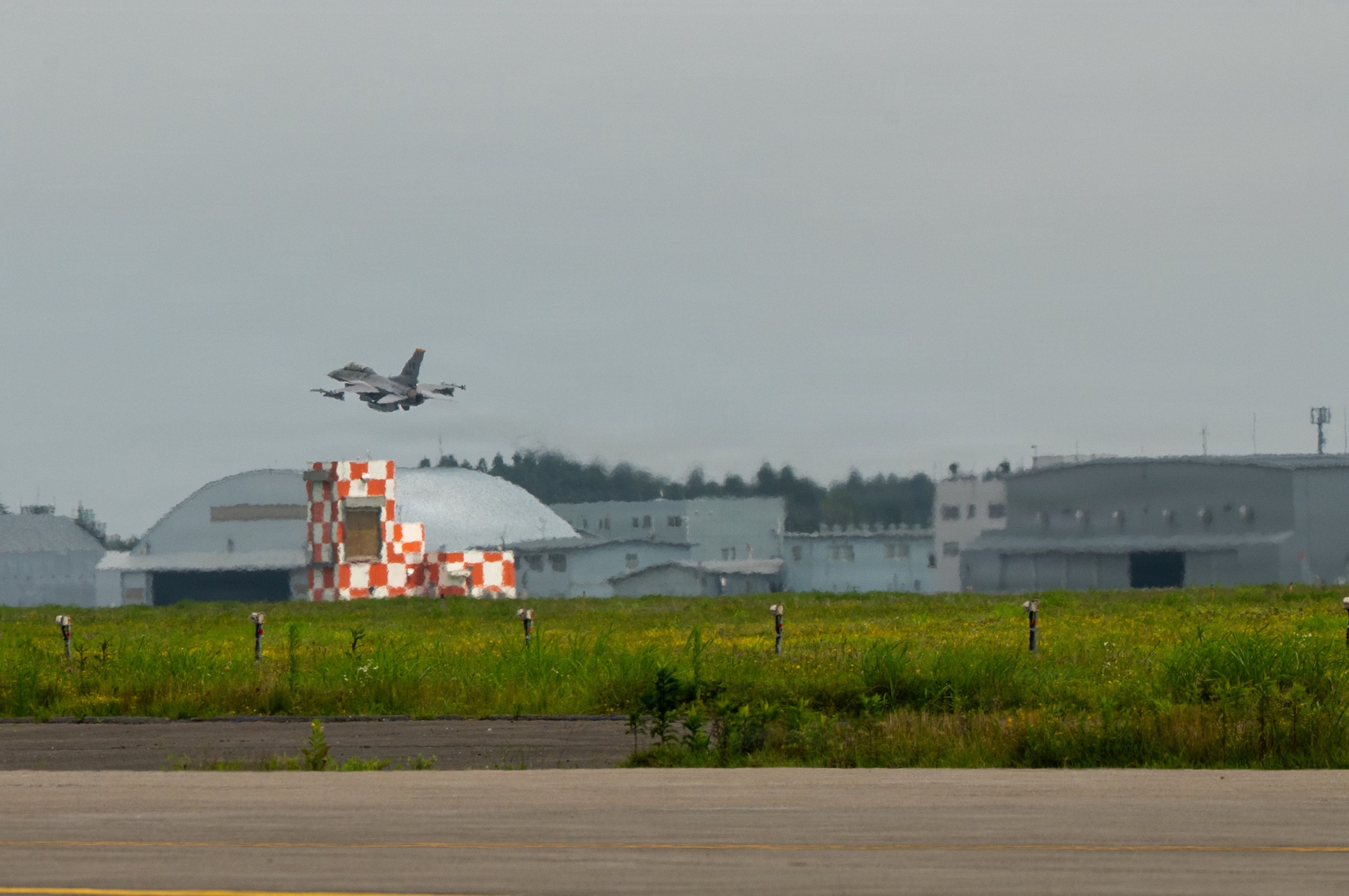 A U.S. Air Force F-16 Fighting Falcon carrying Japan Air Self-Defense Force Lt. Gen. Keita Funakura, Northern Air Defense Force commander, and piloted by U.S. Air Force Col. Jeromy Guinther, 35th Operations Group commander, takes off for a familiarization flight at Misawa Air Base, Japan, July 27, 2026.