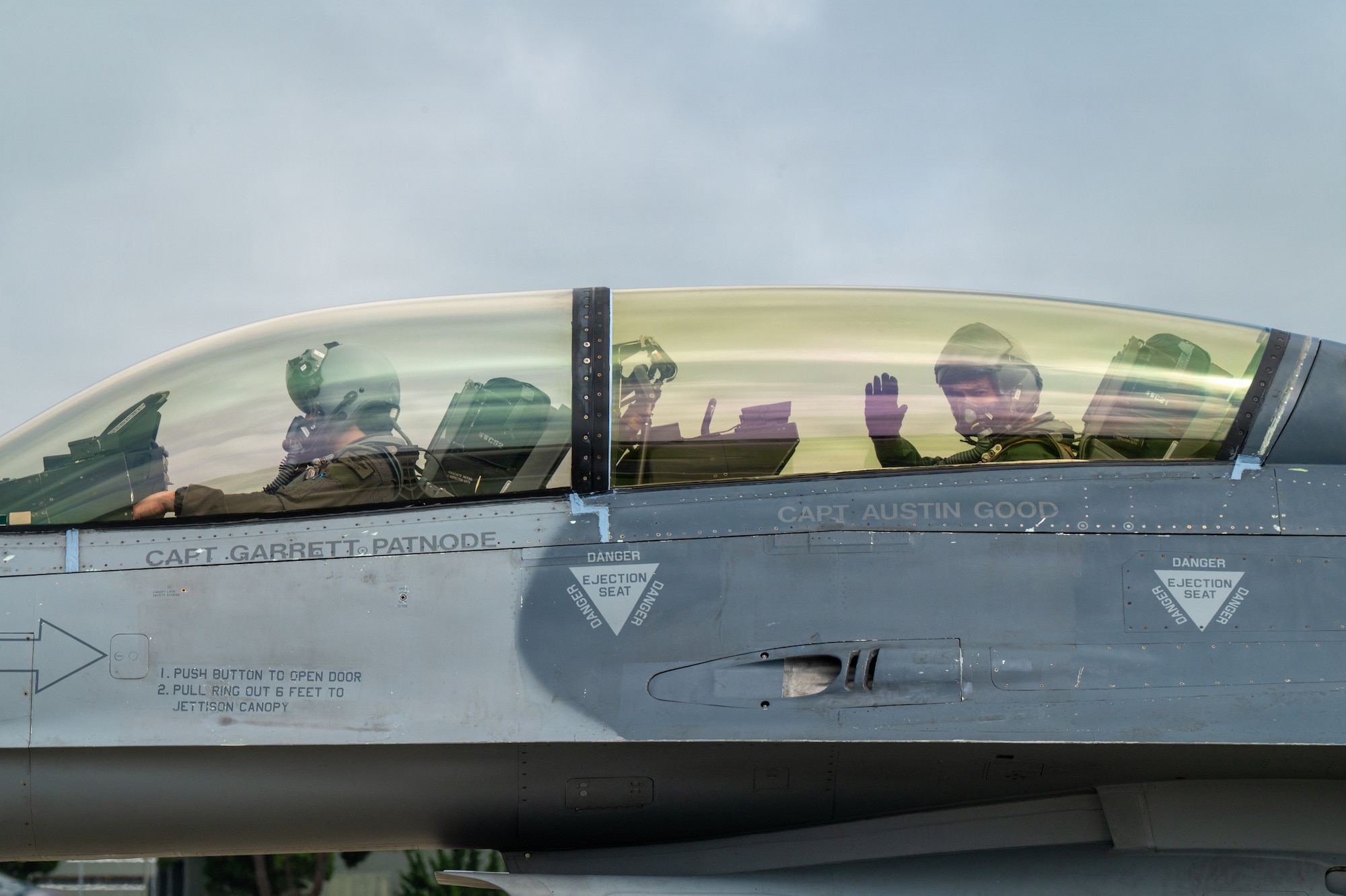 Japan Air Self-Defense Force Lt. Gen. Keita Funakura, Northern Air Defense Force commander, waves from the cockpit of a U.S. Air Force F-16 Fighting Falcon before a familiarization flight with USAF Col. Jeromy Guinther, 35th Operations Group commander, at Misawa Air Base, Japan, July 27, 2026.