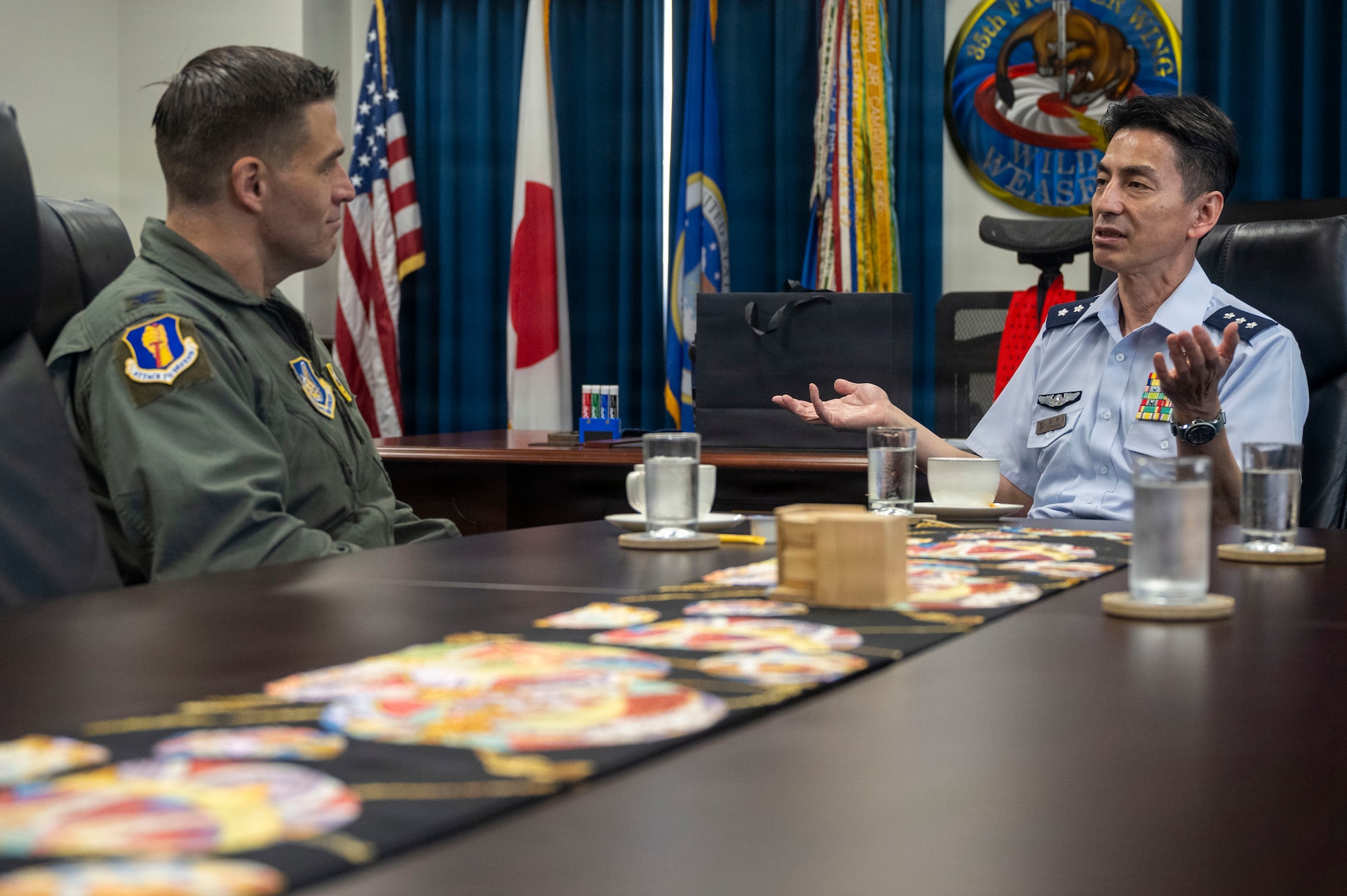 U.S. Air Force Col. Oliver Lause, 35th Fighter Wing commander, left, and Japan Air Self-Defense Force Lt. Gen. Keita Funakura, Northern Air Defense Force commander, discuss bilateral cooperation during an office call at Misawa Air Base, Japan, July 28, 2026.