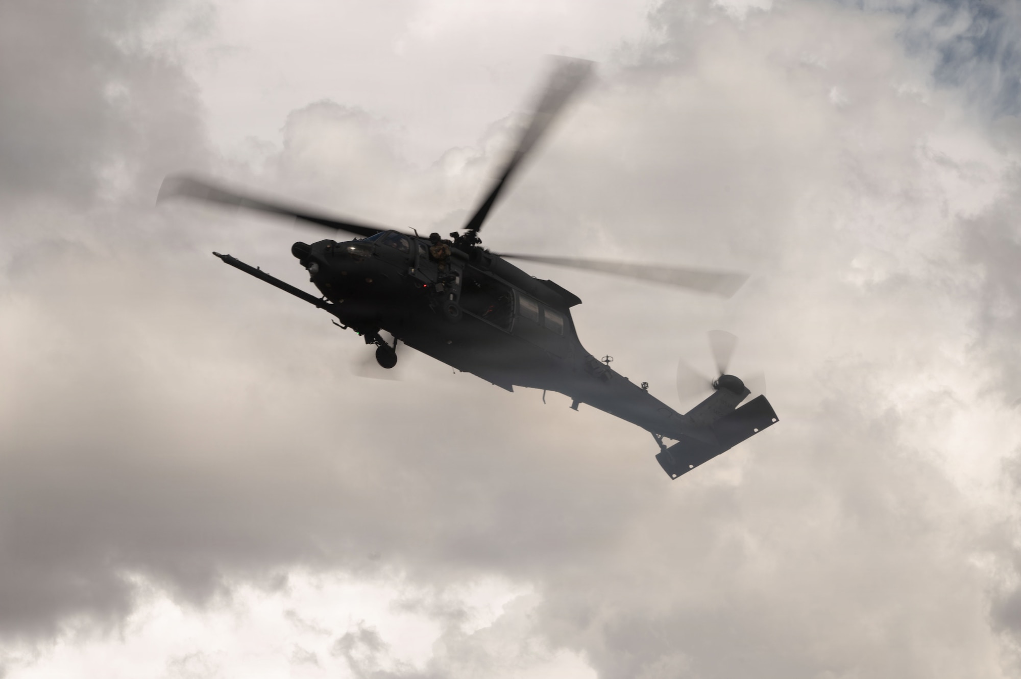 A HH-60W Jolly Green II aircraft assigned to Davis-Monthan Air Force Base, flies overhead during Operation Iron Covenant near Benson, Arizona, July 22, 2026. U.S. Special Warfare Airmen performed sorties to strengthen personnel recovery capabilities and prepare rescue forces for deployment through realistic, scenario-based training. (U.S. Air Force photo by Airman Najzee Kuzu)