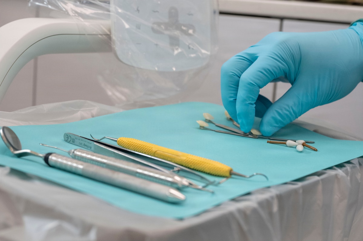A U.S. Air Force dental technician assigned to the 35th Medical Group selects a shade tab for a restorative dental procedure at Misawa Air Base, Japan, July 28, 2026.
