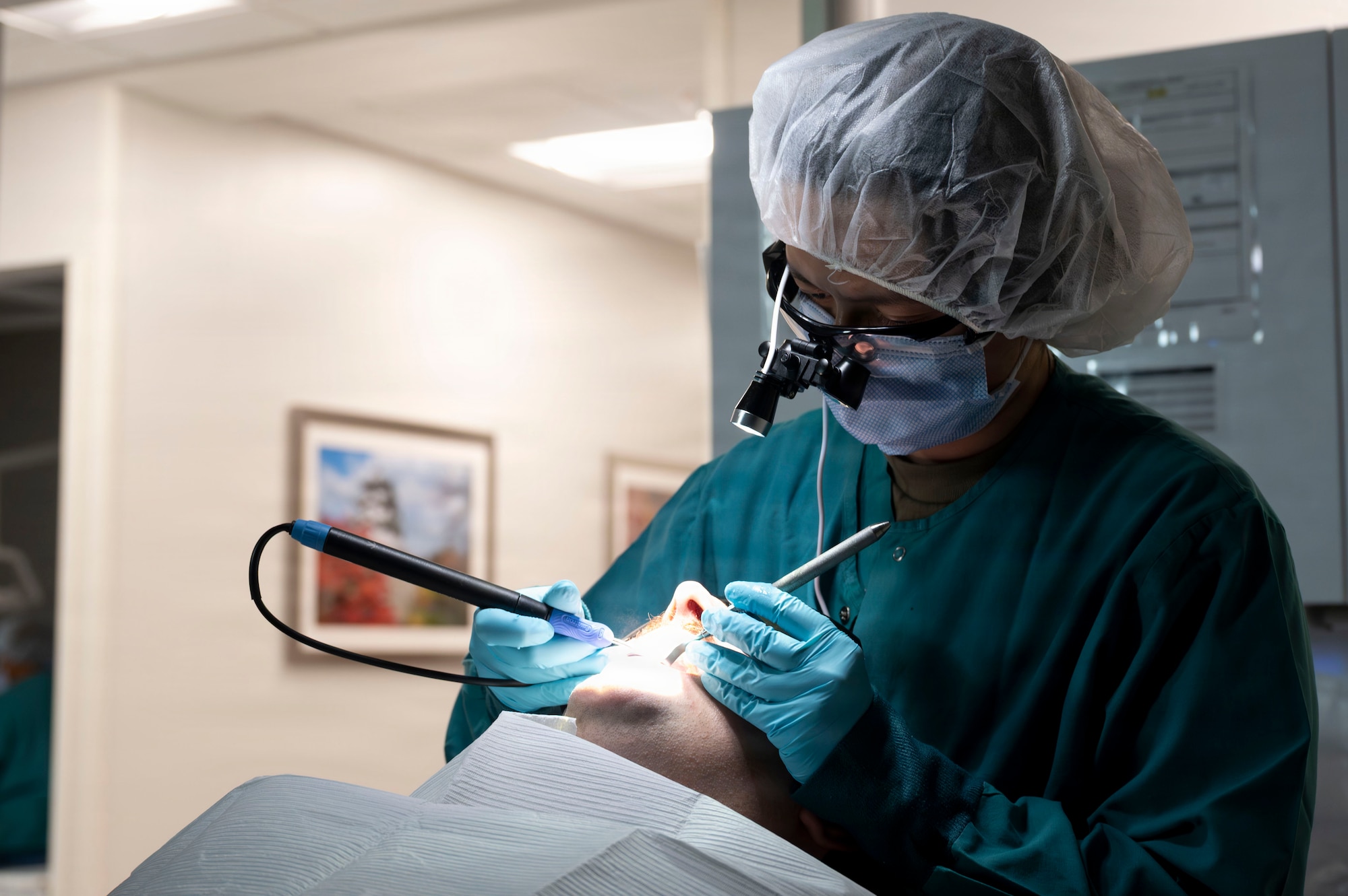 U.S. Air Force Senior Airman Emily Adinolfi, 35th Medical Group prophylaxis technician, performs a dental cleaning on a patient at Misawa Air Base, Japan, July 28, 2026.