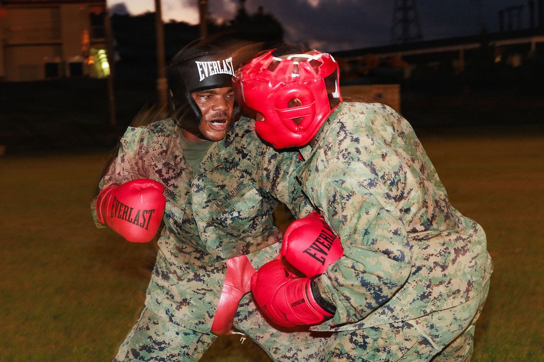 U.S. Marine Corps Cpl. Daryus Moore, a network administrator with 7th Communications Battalion, III Marine Expeditionary Force Information Group, spars with another Marine during martial arts instructor course 91-26 on Camp Courtney, Okinawa, Japan, on July 24, 2026.