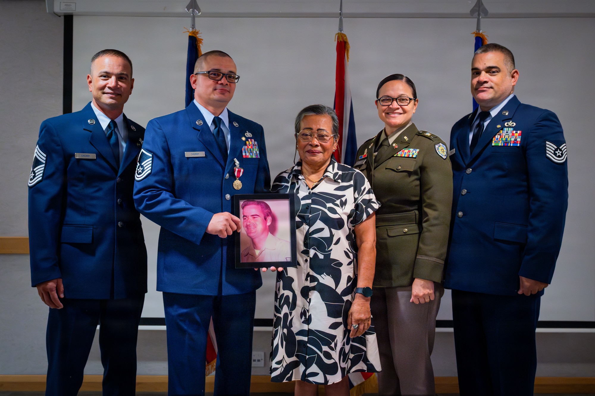U.S. Air Force Master Sgt. Jonathan Cherry, center left, poses with his family during his retirement ceremony at RAF Mildenhall, England, July 9, 2026.