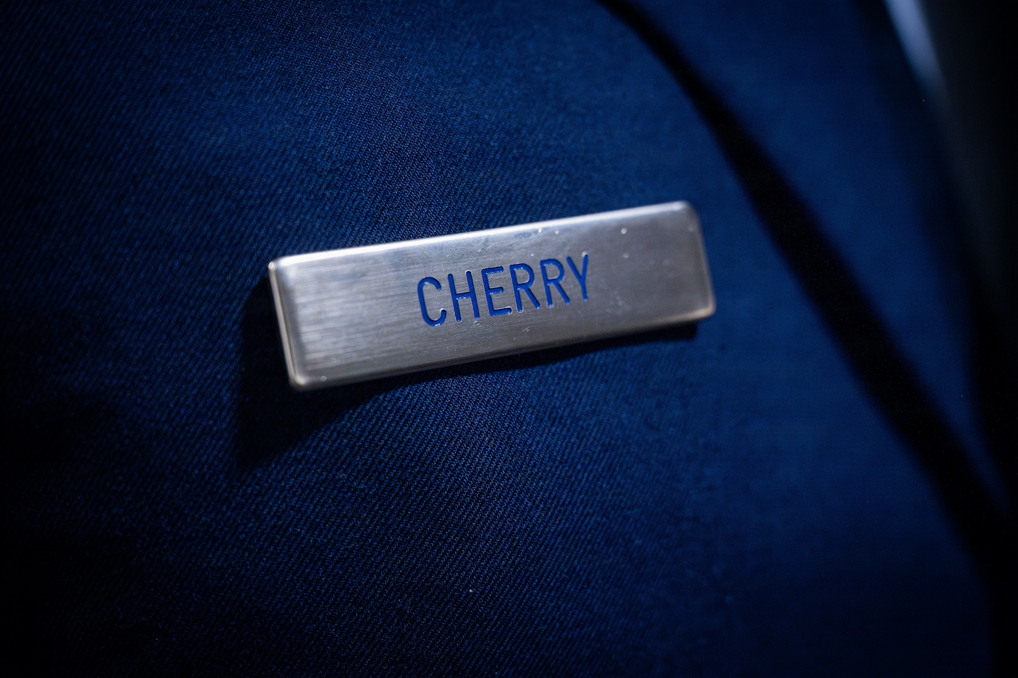 A nametag displaying Cherry is pinned on a uniform at RAF Mildenhall, England, July 9, 2026.