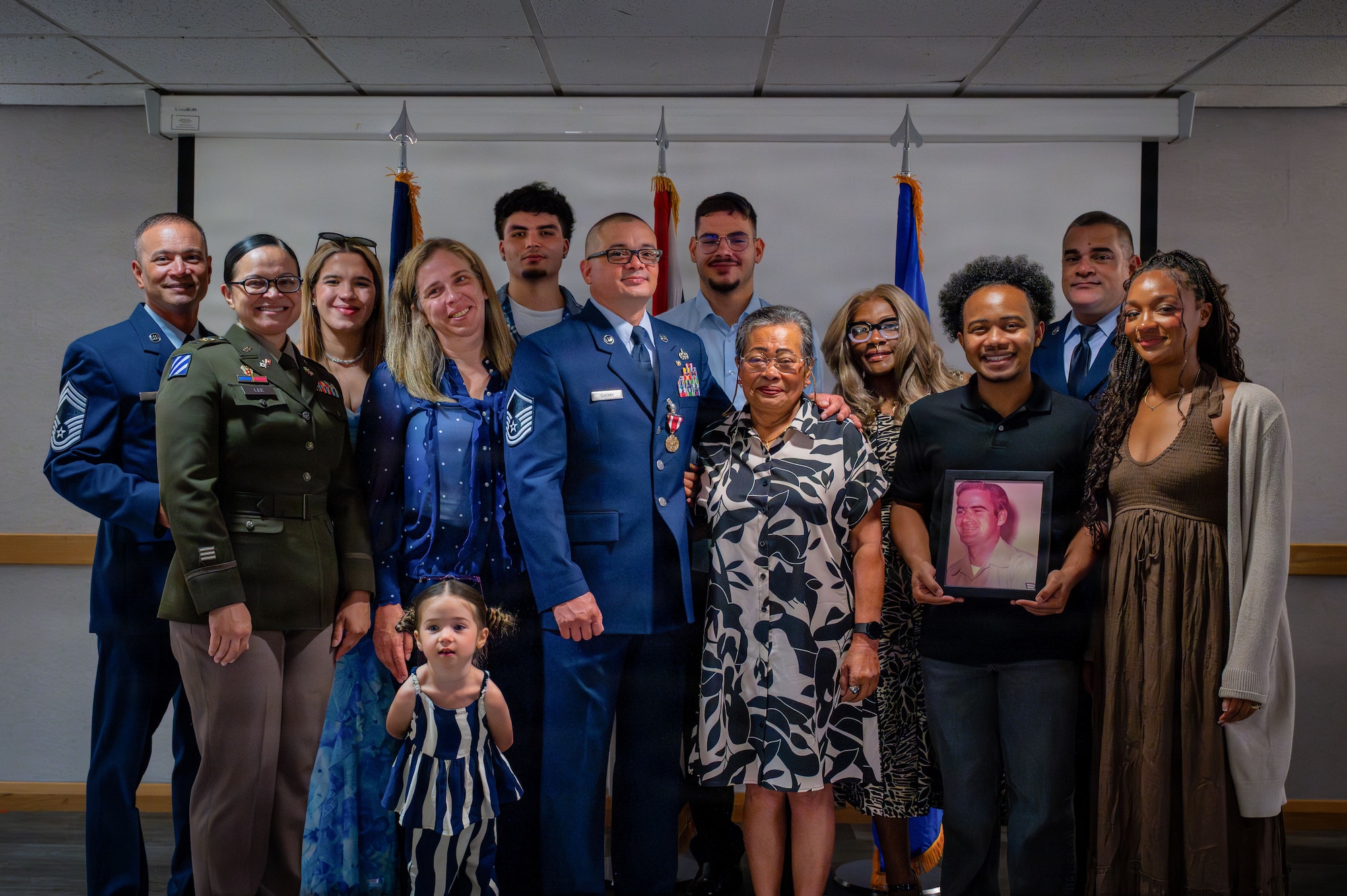The Cherry family poses for a photo commemorating the retirement of U.S. Air Force Master Sgt. Jonathan Cherry, 100th Logistics Readiness Squadron fuels flight chief, at RAF Mildenhall, England, July 9, 2026.