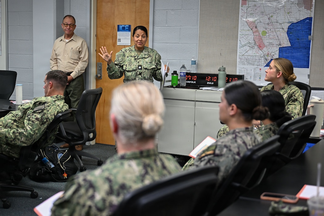 Cmdr. Carmen Davis, evaluator, Navy Reserve-Naval Medical Forces Development Command, speaks to Sailors selected to serve as fleet subject matter experts for the first-of-its-kind Operational Readiness Evaluation (ORE) of an Expeditionary Medical Unit (EMU), and first ever afloat ORE for an EMU, July 24, 2026. (U.S. Navy photo by Mass Communication Specialist 1st Class Shayla D. Hamilton)