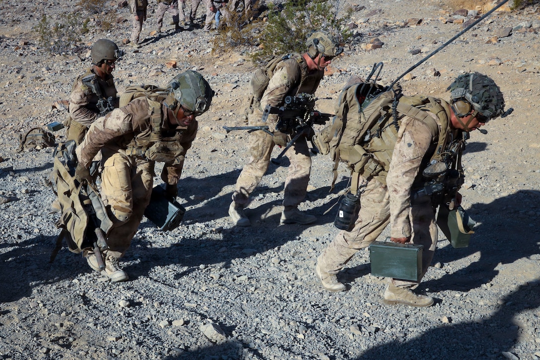 U.S. Marines with 2nd Battalion, 2nd Marine Regiment, 2nd Marine Division, sprint up a hill during a company attack on Range 400 as part of Service Level Training Exercise 4-26 on Marine Corps Air Ground Combat Center, Twentynine Palms, California, July 28, 2026. SLTE 4-26 is designed to be a challenging, realistic training environment that produces combat-ready forces capable of operating as an integrated Marine Air Ground Task Force across all domains of military operations. (U.S. Marine Corps photo by Staff Sgt. Matthew Kirk)
