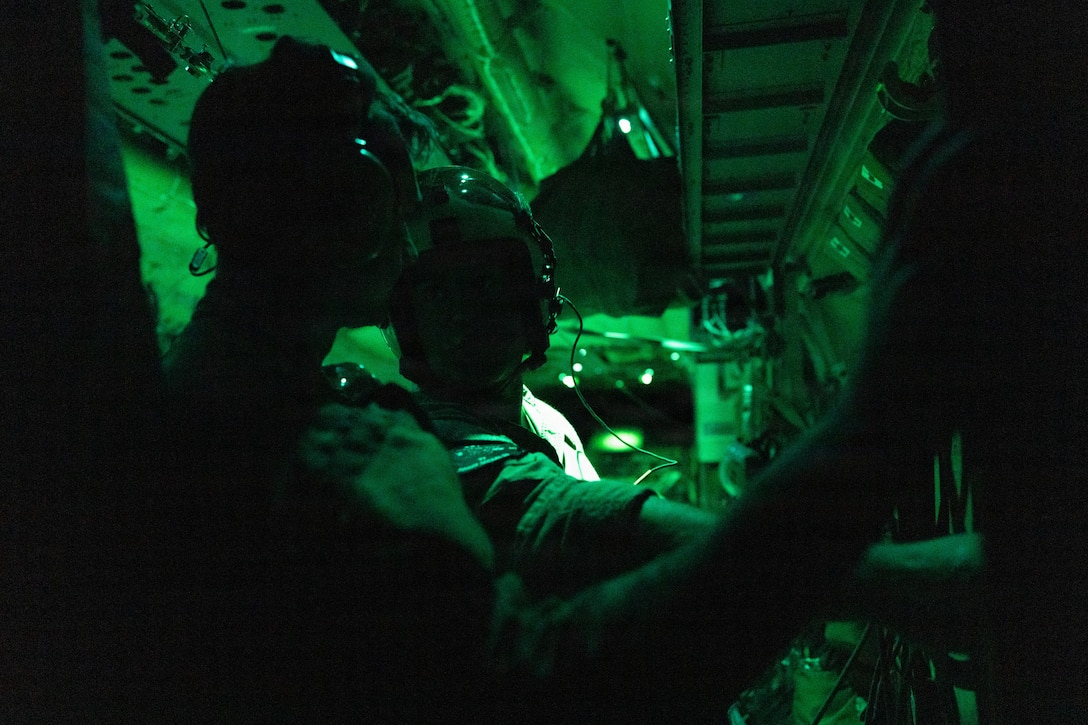 U.S. Marine Corps Staff Sgt. Colt Houseknecht, from Indiana, a fixed-wing aircraft flight engineer with Marine Aerial Refueler Transport Squadron (VMGR) 252, Marine Aircraft Group 14, 2nd Marine Aircraft Wing, and a U.S. Air Force 57th Rescue Squadron airman prepare for a combat-ready pararescue training during a Marine Corps Combat Readiness Evaluation at Davis-Monthan Air Force Base, Tucson, Arizona, July 21, 2026. Marines with VMGR-252 trained alongside Marine Medium Tiltrotor Squadron (VMM) 266 and elements of the U.S. Air Force to increase expeditionary capabilities, refine aircrew proficiency and ensure combat readiness. (U.S. Marine Corps photo by Lance Cpl. Jacsive Betancourt)