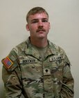 U.S. Army Spc. Boecker, an infantryman assigned to the Minnesota National Guard's Moorhead-based 2nd Combined Arms Battalion, 136th Infantry Regiment, stands for a photo in Elk River, Minnesota, July 11, 2026.