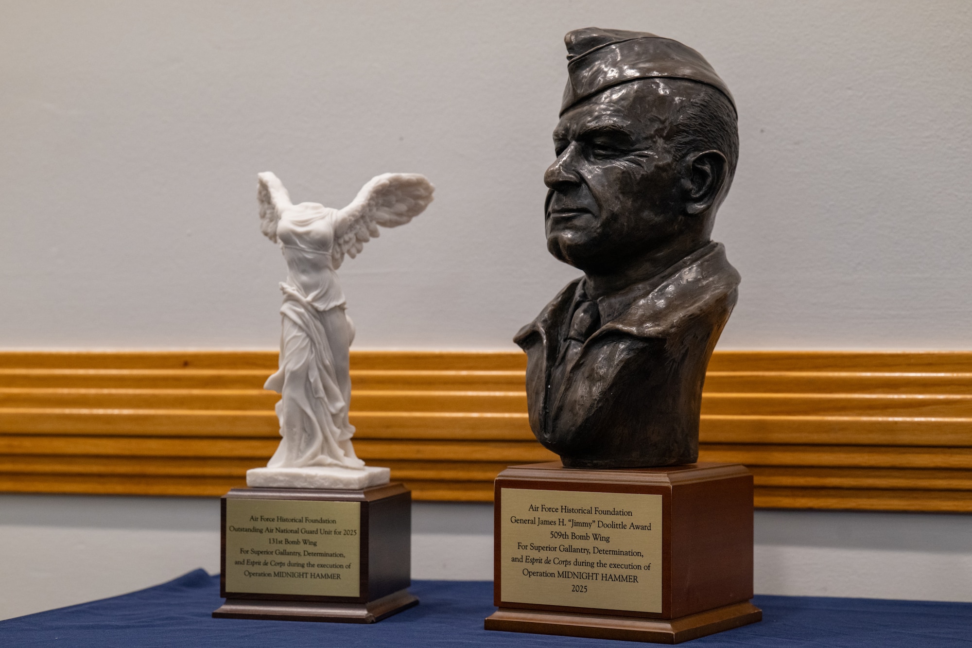 The Air Force Historical Foundation's 2025 James H. "Jimmy" Doolittle Award and the Air National Guard Award for Superior Unit Performance are shown on a table at Whiteman Air Force Base, Missouri, July 28, 2026. These awards recognize Air Force units for gallantry, determination, esprit de corps, and superior management of joint operations in accomplishing its mission under difficult and hazardous conditions in multiple conflicts. (U.S. Air Force photo by Senior Airman Matthew S. Domingos)