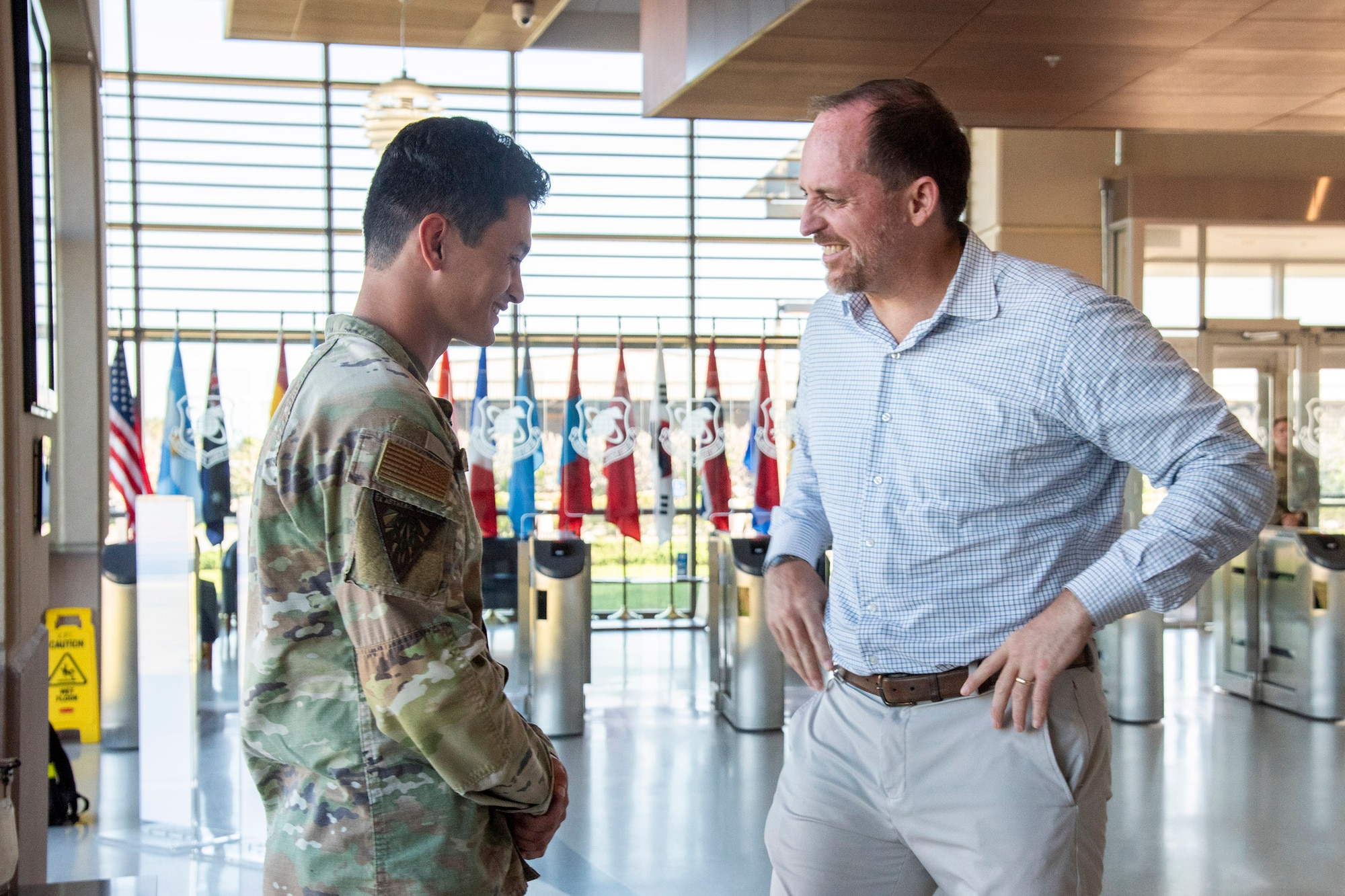 Under Secretary of War (I&S) Bradley Hansell congratulates 2d Lt. Geoffrey Stentiford for his work with the Joint Force on collecting acoustic sensor information for near-instantaneous reporting capability during Operation Epic Fury.  (Photo by Susan A. Romano)