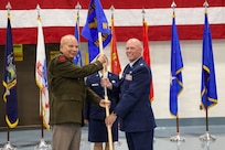 Army Maj. Gen. Ray Shields, the adjutant general of the New York National Guard, passes the guidon of the New York Air National Guard Recruiting and Retention Squadron to Maj. Josh Bowers, the new squadron's commander during the squadron activation ceremony held at the New York National Guard headquarters in Latham, N.Y., July 29, 2026.
