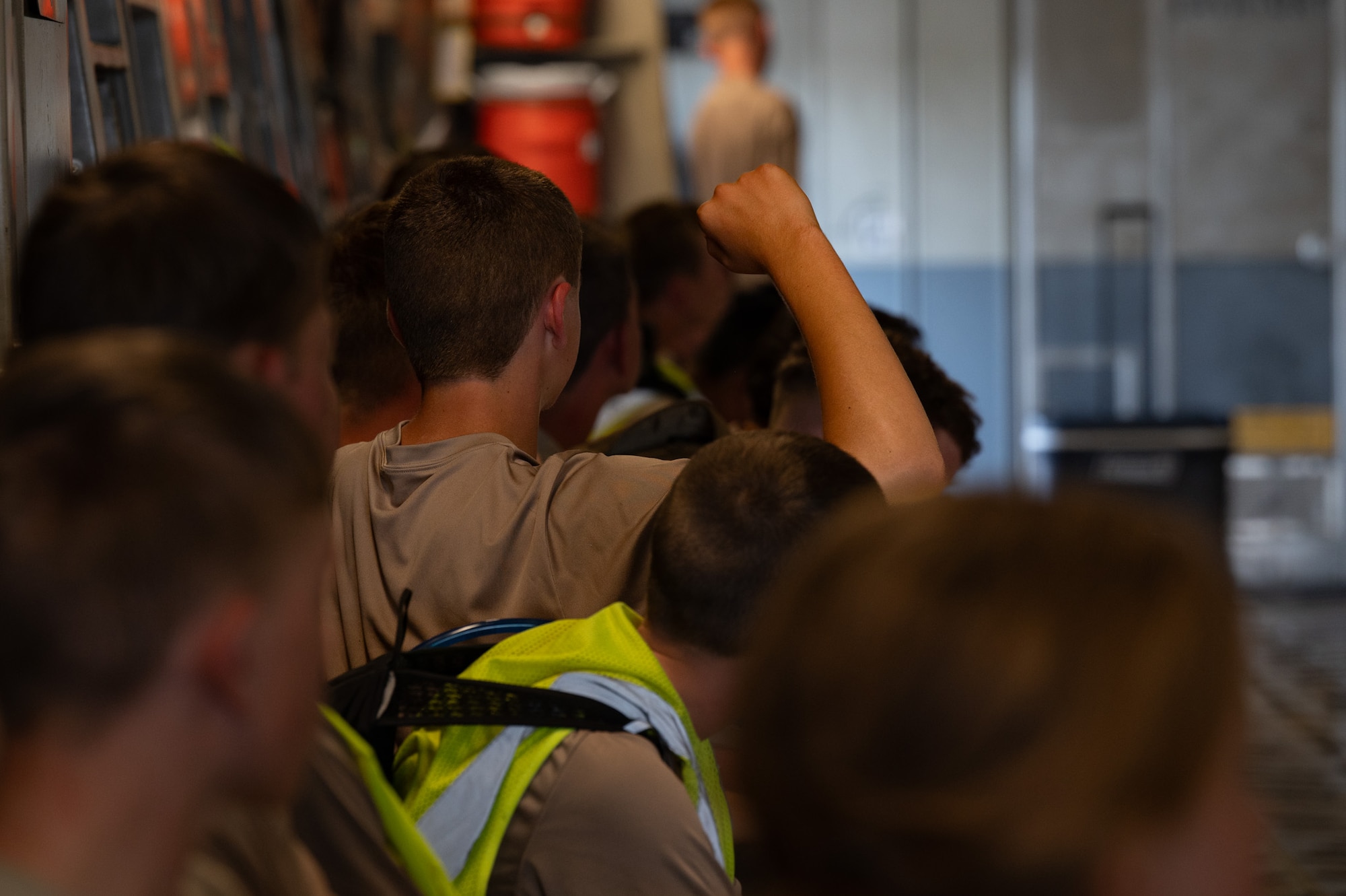 A New York Wing Civil Air Patrol Encampment cadet raises his hand to ask a question during a static display visit at Hancock Field Air National Guard Base, N.Y., July 23, 2026. Cadets participated in a week-long encampment where they built basic leadership qualities and formed camaraderie, all while gaining basic military knowledge. (U.S. Air Force photo by Airman 1st Class Haeleigh Bayle)