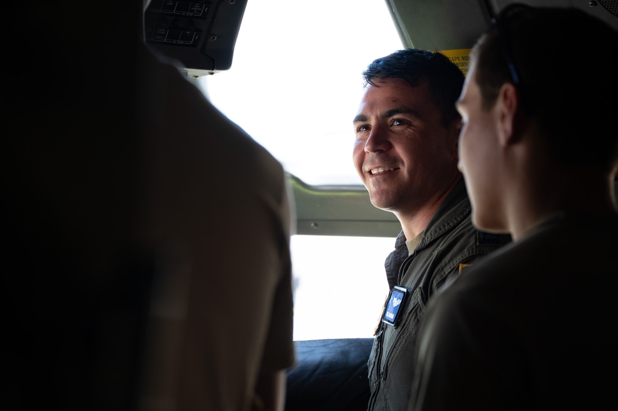 U.S. Air Force Capt. Chris Marookian, 6th Airlift Squadron instructor pilot, talks with New York Civil Air Patrol Encampment cadets during a static display visit at Hancock Field Air National Guard Base, N.Y., July 23, 2026. Marookian explained the different controls and functions of the C-17 Globemaster III. (U.S. Air Force photo by Airman 1st Class Haeleigh Bayle)