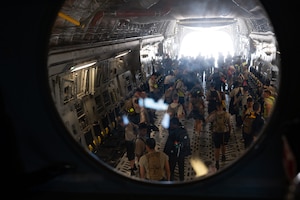 New York Wing Civil Air Patrol Encampment cadets leave a C-17 Globemaster III aircraft static display after interacting with aircrew at Hancock Field Air National Guard Base, N.Y., July 23, 2026. Aircrew shared their experiences and knowledge of the C-17 to inspire future generations of Airmen. (U.S. Air Force photo by Airman 1st Class Haeleigh Bayle)