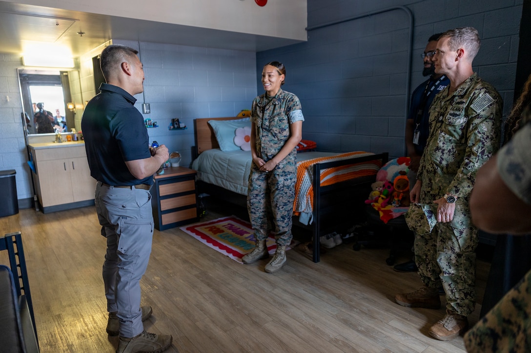 The Honorable Hung Cao, Acting Secretary of the Navy, speaks to service members and civilians while walking through bachelor enlisted quarters as part of a tour at Marine Corps Base Camp Lejeune, North Carolina, July 29, 2026. The tour focused on ongoing installation efforts to improve barracks quality of life and ensure the well-being of Marines and Sailors, as well as on II Marine Expeditionary Force’s and 2nd Marine Aircraft Wing’s contributions to defending the homeland and projecting combat power through the generation of crisis-ready Marine Expeditionary Units and support to major operations across the Southern Hemisphere. (U.S. Marine Corps photo by Sgt. Andrew King)