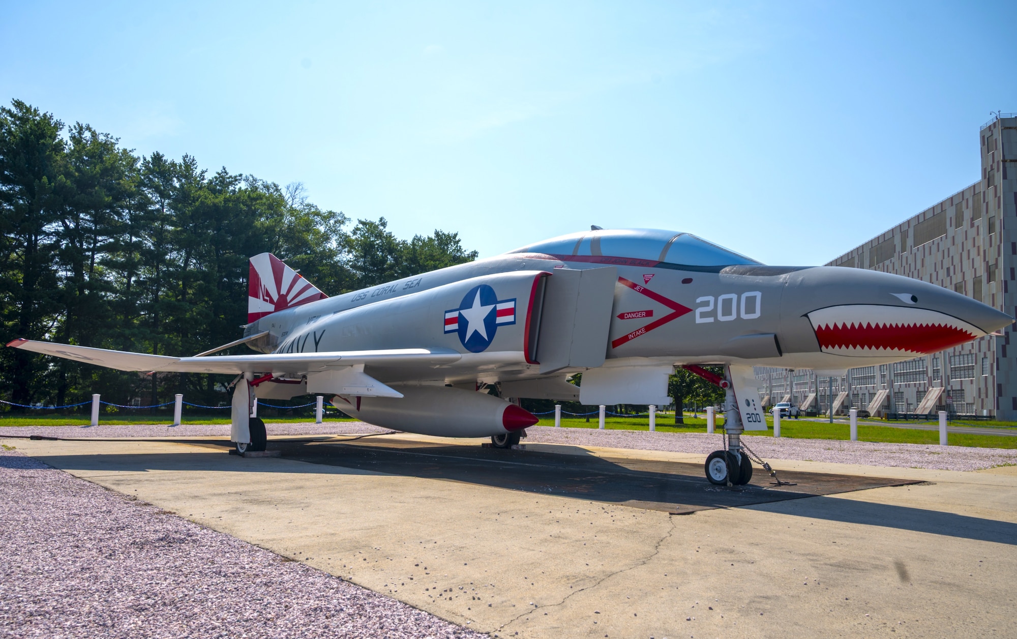 The newly restored F4 Phantom military aircraft is displayed in the Navy Lakehurst Air Park at Joint Base McGuire-Dix-Lakehurst, N.J., July 1, 2026. The restoration, which took a team of volunteers 13 months to complete, included sheet metal and canopy repair, sanding the aircraft from the top down, and application of paint, lettering, insignia and clear coating for long-lasting preservation. (U.S. Air Force photo by Susan Moriarty)