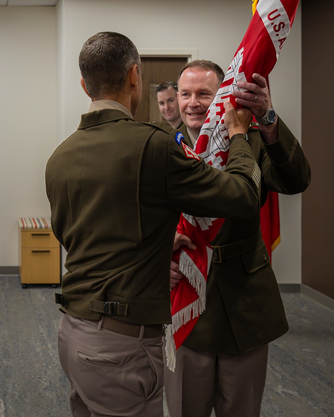 Col. John Moran, Louisville District commander, receives the U.S. Army Corps of Engineers flag from Brig. Gen. Dan Herlihy during a change of command ceremony, July 30, 2026 in Louisville, Kentucky.