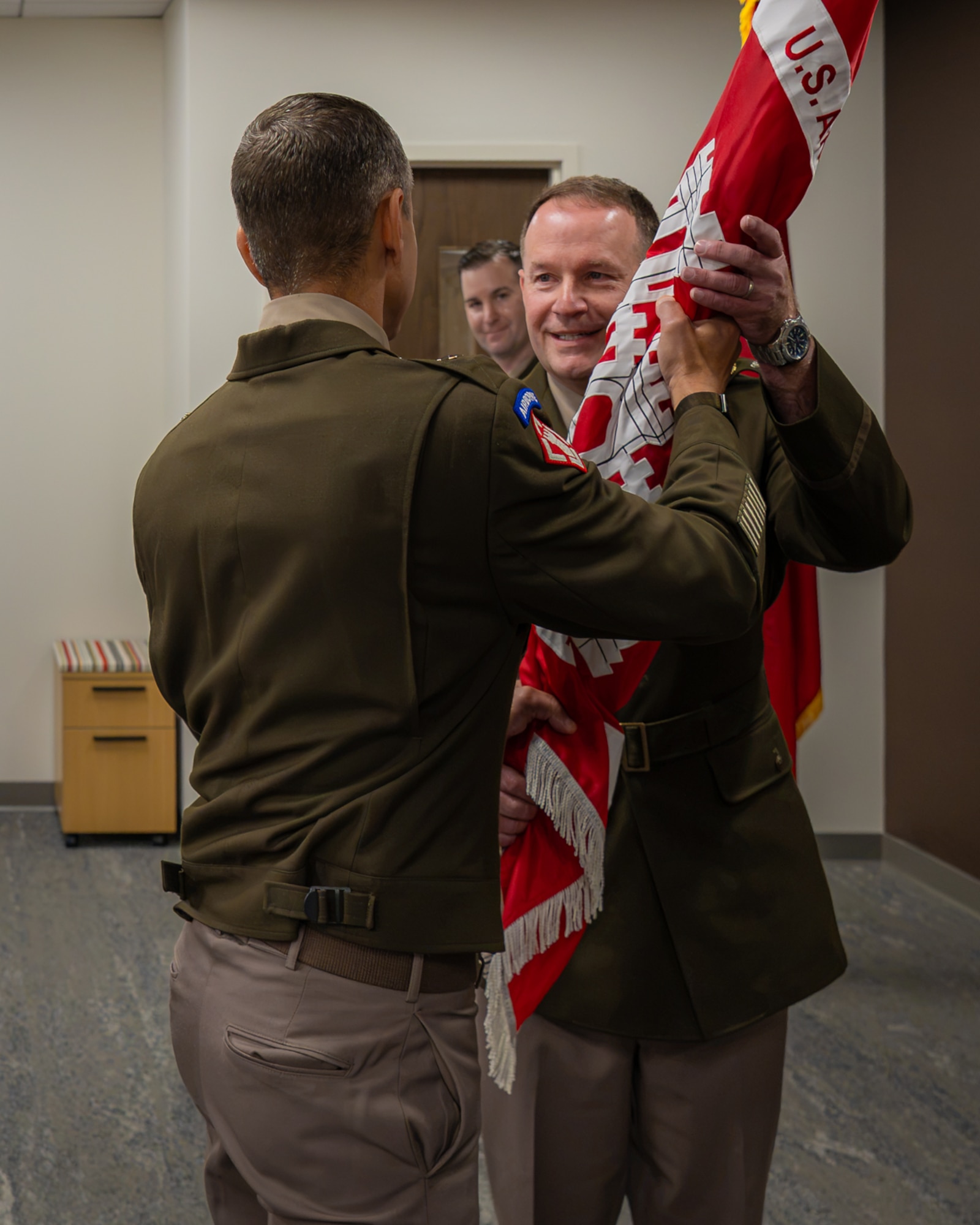 Col. John Moran, Louisville District commander, receives the U.S. Army Corps of Engineers flag from Brig. Gen. Dan Herlihy during a change of command ceremony, July 30, 2026 in Louisville, Kentucky.