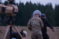 Staff Sgt. Kevin Propes, Survey Team Member, 10th Civil Support Team, Washington National Guard, talks with representatives from Anduril Industries during a new technology fielding of an advanced counter-unmanned aircraft systems.