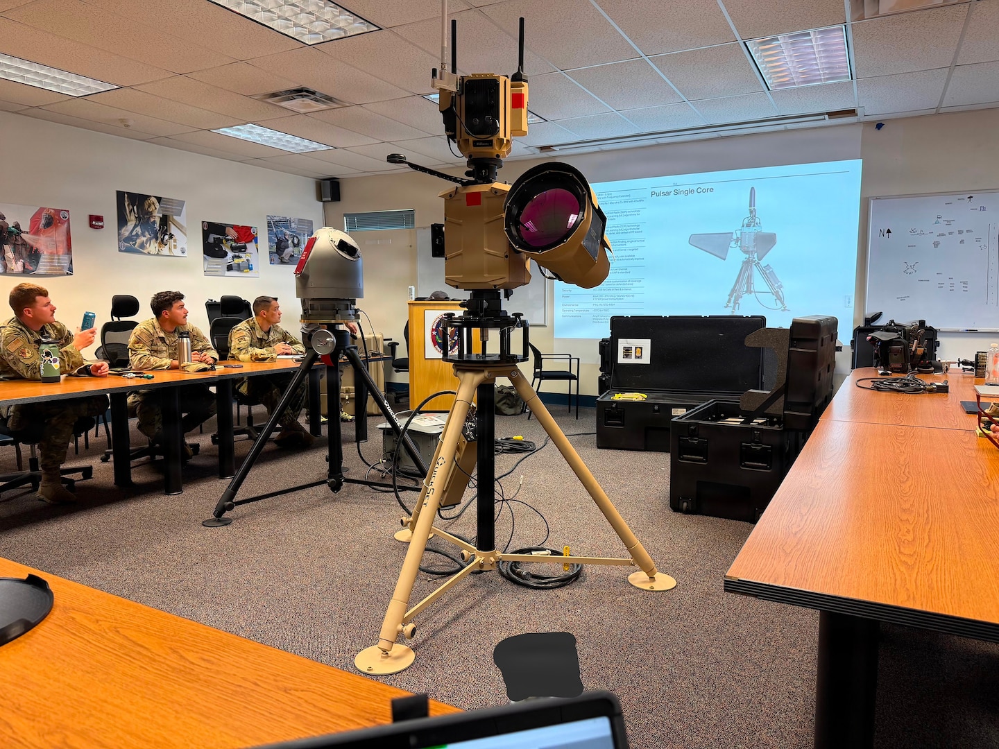 Soldiers and Airmen from the Washington National Guard's 10th Civil Support Team receive a briefing on an advanced counter-unmanned aircraft systems at their office at Camp Murray, Washington, June 23, 2026.