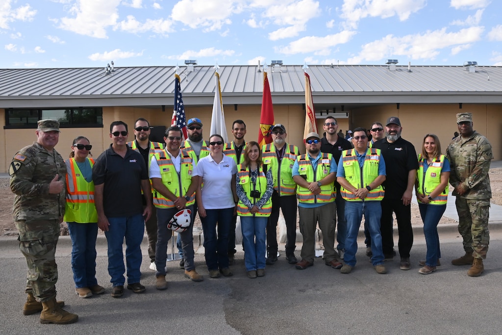 The U.S. Army Corps of Engineers’ Fort Worth District staff came together at the completion of the ribbon-cutting on Fort Bliss for the first of 10 3D-printed buildings to be completed for the new Joint Task Force, Southern Border Campus. The group includes team members from the district offices in Fort Worth along with members of the South Texas and Southwest area offices. The group is flanked by the Fort Worth District Commander, Col. Calvin Kroeger, left, and Col. Marlon Ringo, the incoming commander.