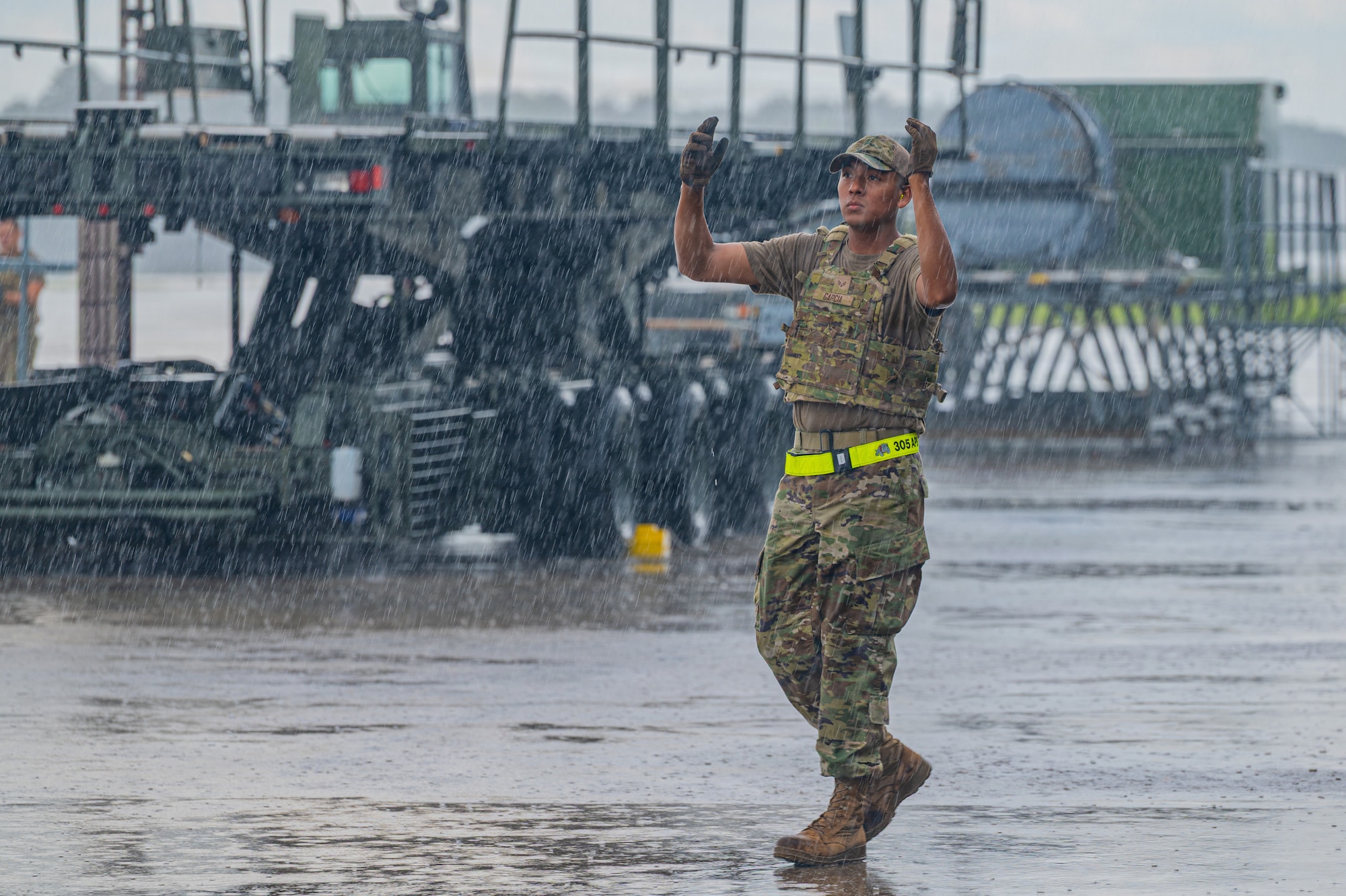 Airmen directs forklift