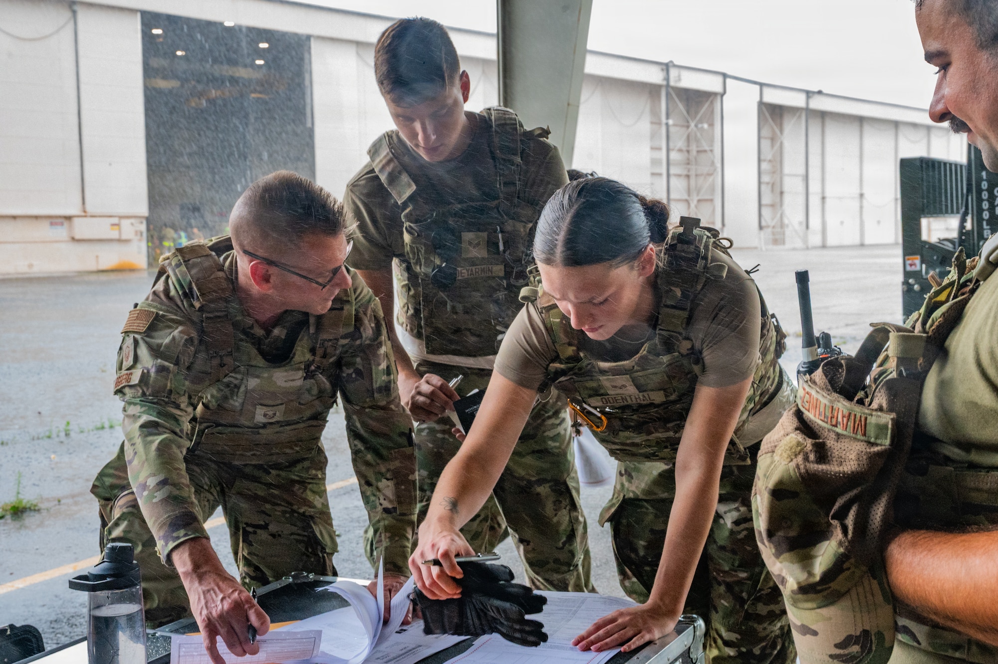 Airmen looking at papers