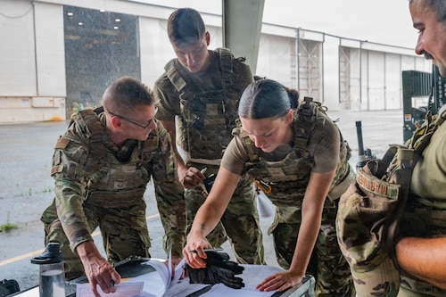 Airmen looking at papers
