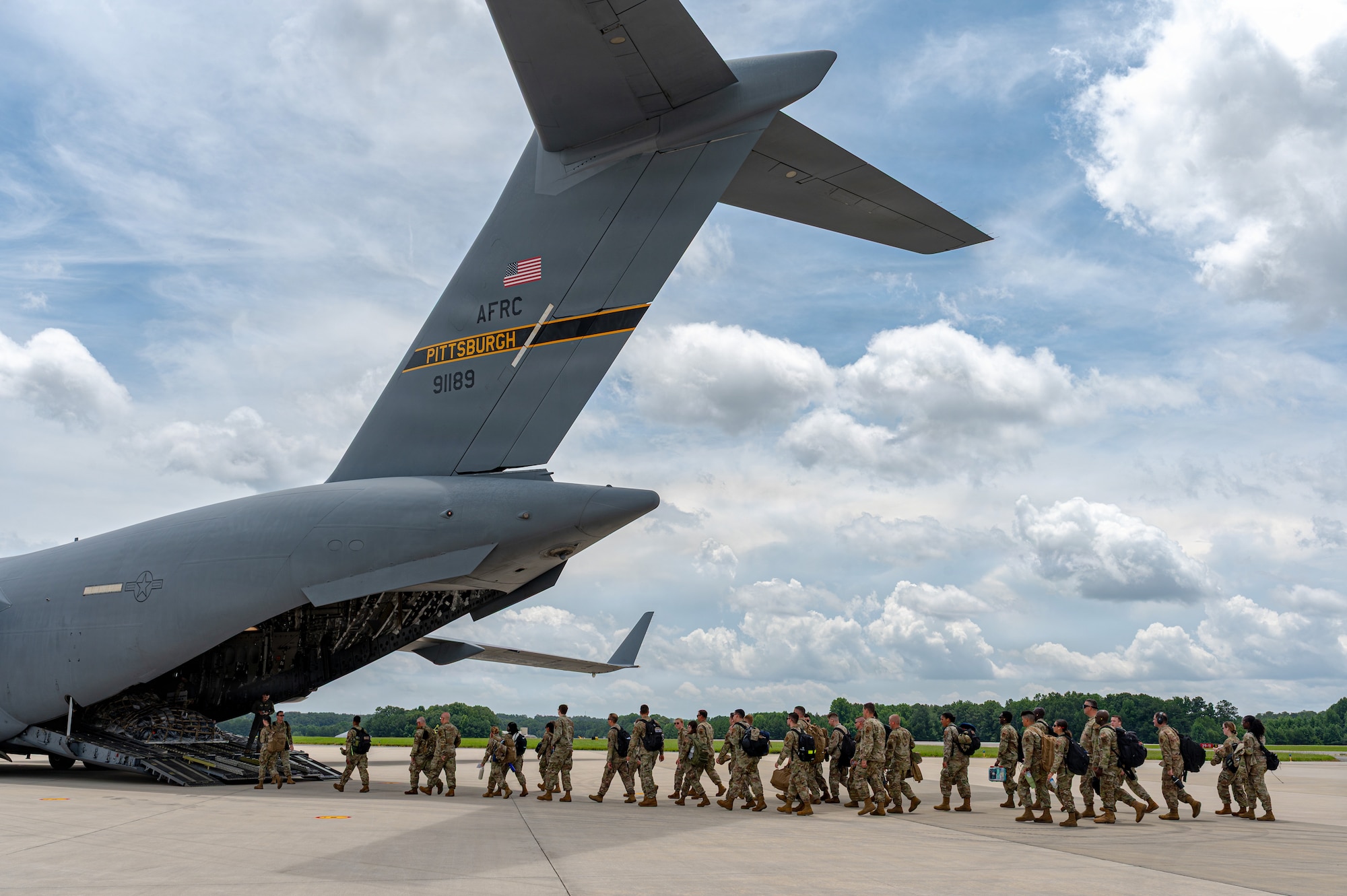 Airmen walking onto aircraft