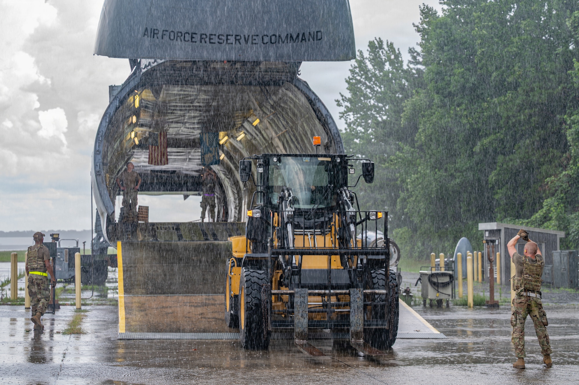 Forklift loading cargo onto aircraft
