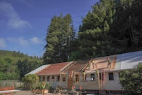 U.S. Airmen assigned to the 201st Rapid Engineer Deployable Heavy Operational Repair Squadron Engineers, 193rd Special Operations Wing and 111th Attack Wing, Pennsylvania Air National Guard, work on roof structures during an Innovative Readiness Training project at Redwood National and State Parks near Orick, California, July 17, 2026