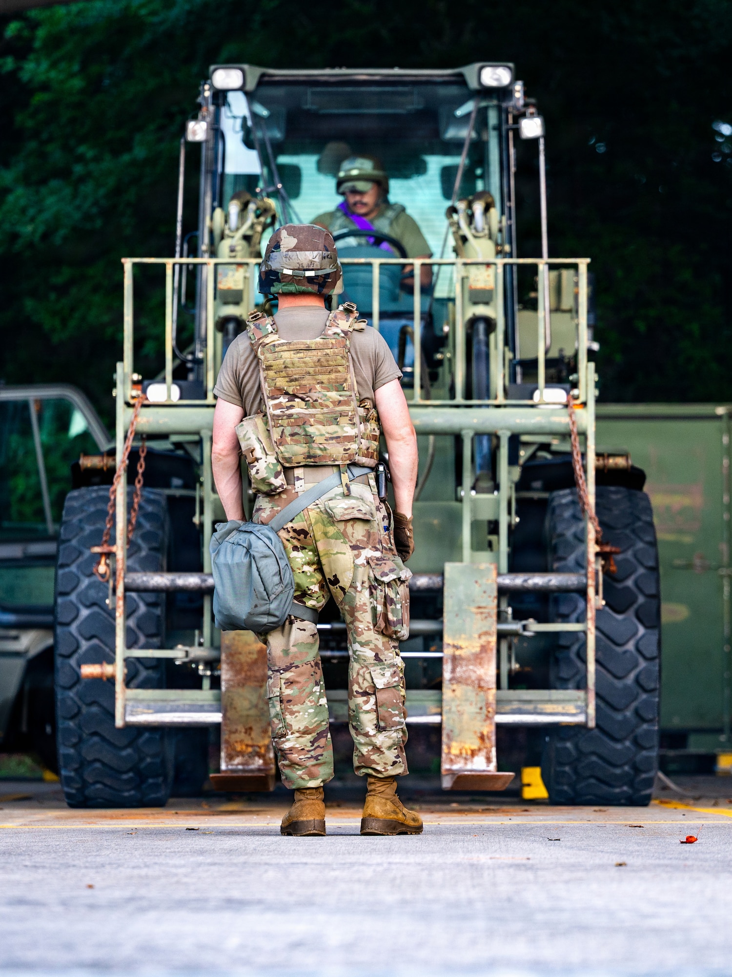 Airman directs forklift