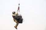 Staff Sgt. Randy Scales, readiness noncommissioned officer, assigned to C Company, 1st Battalion, 189th General Support Aviation Battalion, Montana Army National Guard, rides with a litter during VITA Rescue System training at Fort Harrison, Montana, July 29, 2026. The training certified instructor personnel on the new hoist rescue capability before the instructor personnel train additional aircrew members across the unit. Photo by Senior Master Sgt. Devin Doskey.
