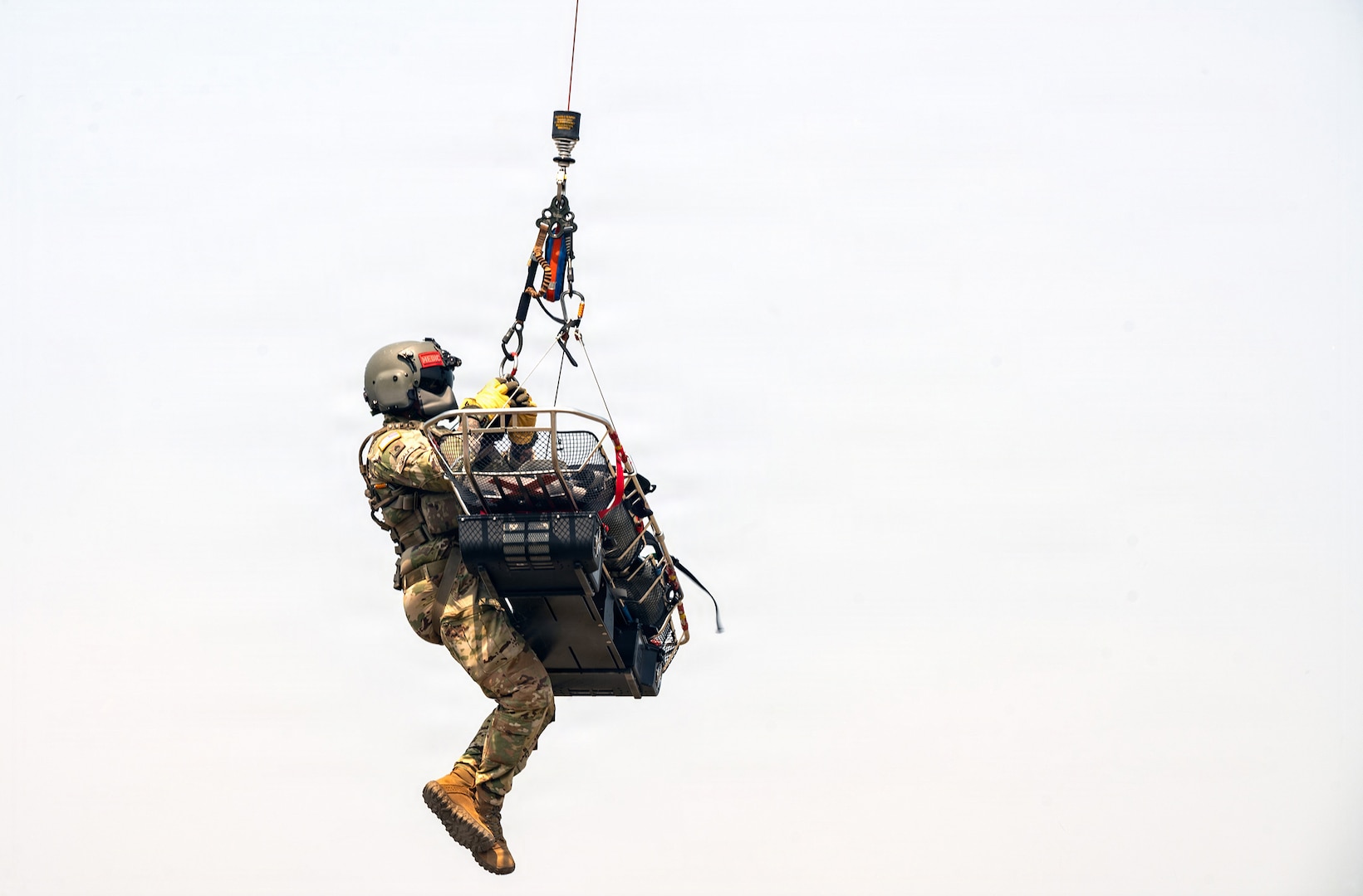 Staff Sgt. Randy Scales, readiness noncommissioned officer, assigned to C Company, 1st Battalion, 189th General Support Aviation Battalion, Montana Army National Guard, rides with a litter during VITA Rescue System training at Fort Harrison, Montana, July 29, 2026.