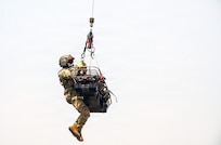 Staff Sgt. Randy Scales, readiness noncommissioned officer, assigned to C Company, 1st Battalion, 189th General Support Aviation Battalion, Montana Army National Guard, rides with a litter during VITA Rescue System training at Fort Harrison, Montana, July 29, 2026.