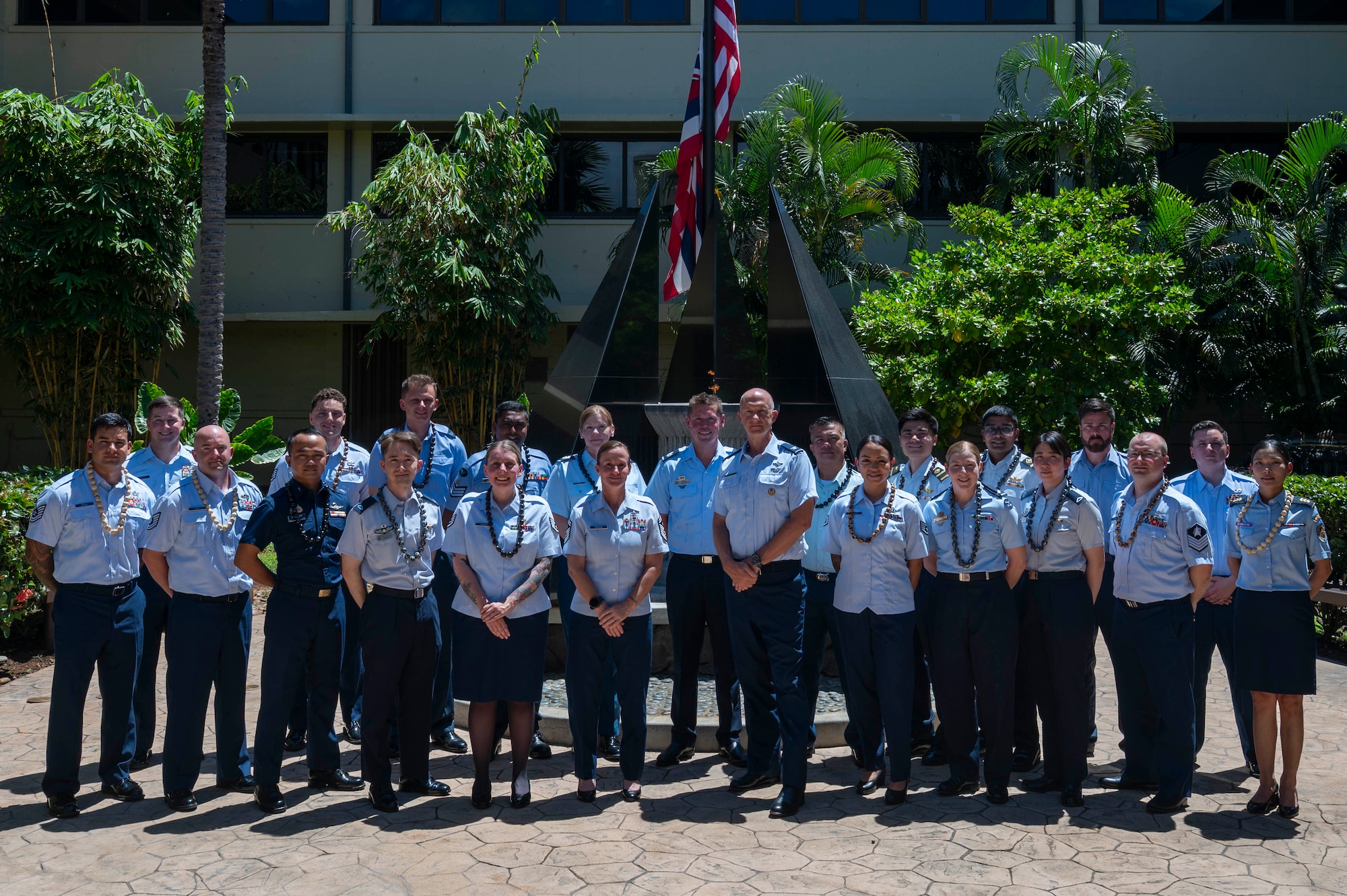 Multinational military members pose together for a group photo