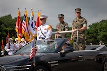 Commanding General of III Marine Expeditionary Force, U.S. Marine Corps Lt. Gen. Benjamin Watson, right, and Republic of Korea Marine Corps Lt. Gen. Ju Il-Seok, 37th commandant of the Republic of Korea Marine Corps, ride in a parade car during a tour of ROK Marine Corps headquarters in Hwaseong, South Korea, July 24, 2026. Watson toured the base to discuss bilateral training operations as a part of Korean Marine Exchange Program 26.2. The Korean Marine Exchange Program is a semiannual bilateral exercise designed to improve combined readiness, strengthen the Republic of Korea–U.S. alliance and promote stability in the Indo-Pacific region. (U.S. Marine Corps photo by Lance Cpl. Marcus Henson)