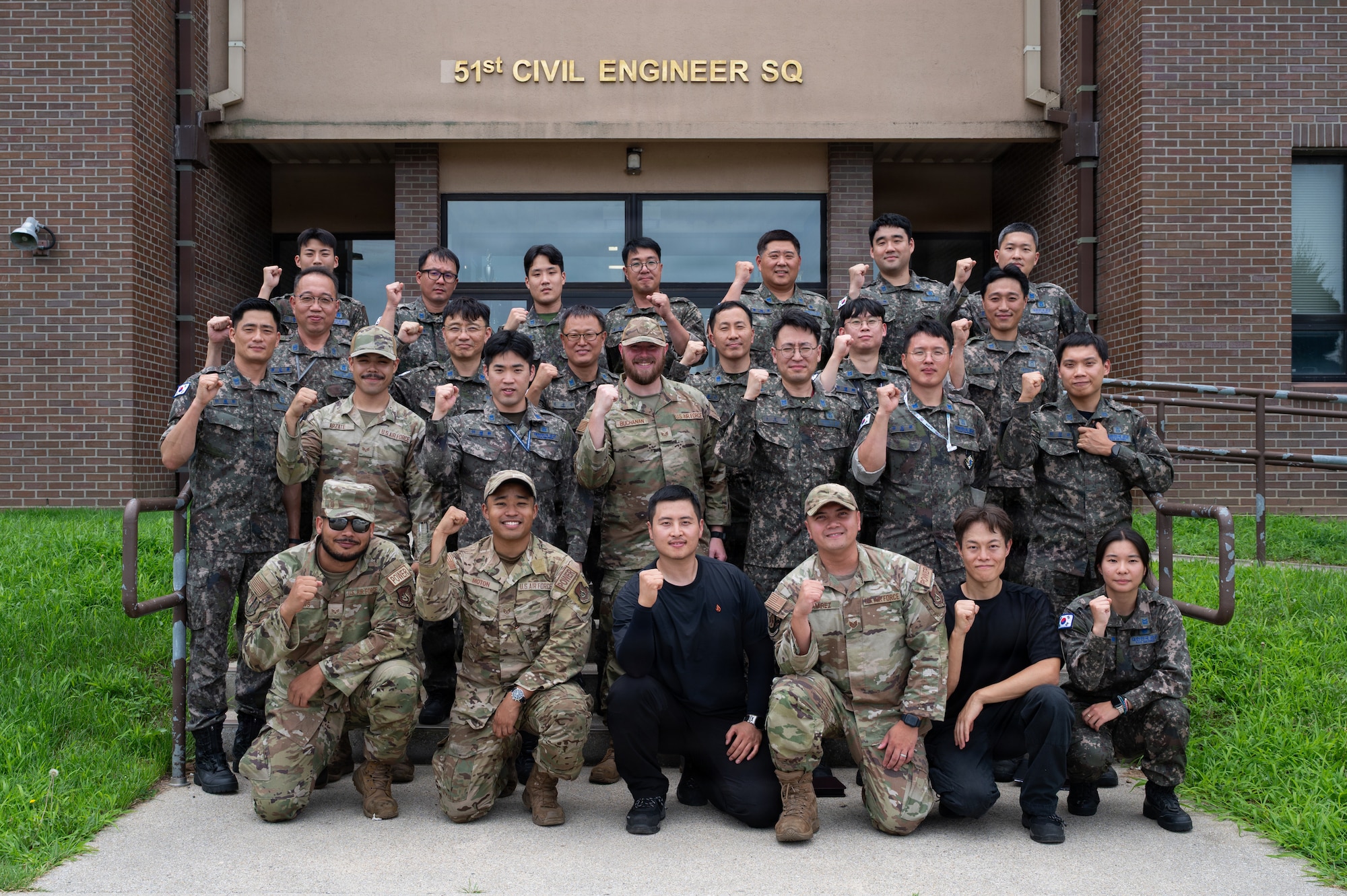 Group photo in front of 51st Civil Engineer Squadron building