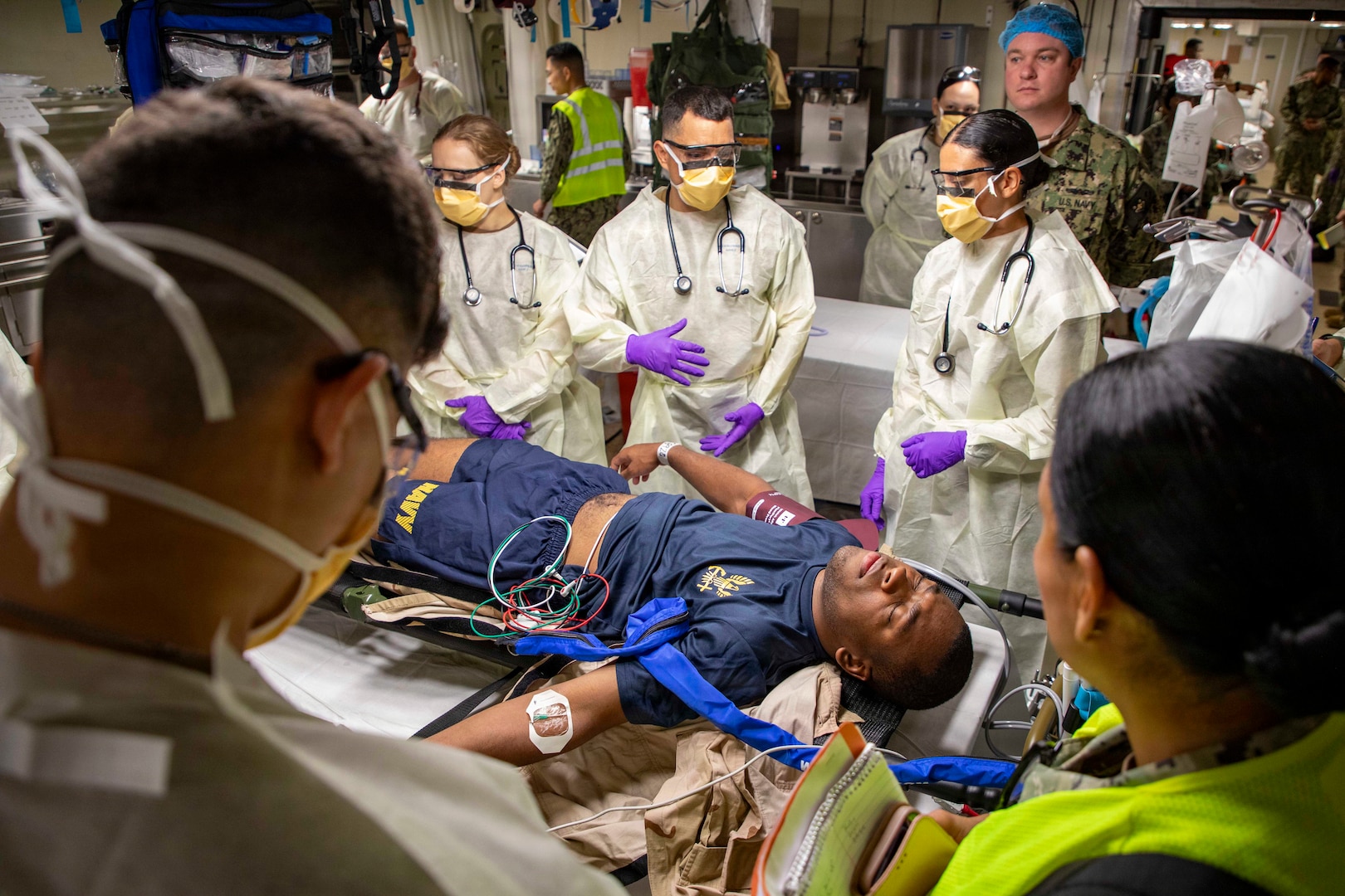 Sailors assigned to the Expeditionary Medical Unit (EMU-2) evaluate a simulated casualty during the unit’s Operational Readiness Evaluation (ORE) aboard the expeditionary fast transport ship USNS Point Loma (T-EPF 15), July 25, 2026. The event marked the Navy’s first ORE conducted for an EMU, and the first afloat ORE for the Navy’s expeditionary medical capability, a critical step in validating deployable medical capabilities in support of maritime operations, distributed maritime operations, and warfighter readiness. (U.S. Navy photo by Mass Communication Specialist 1st Class Nathan T. Beard)