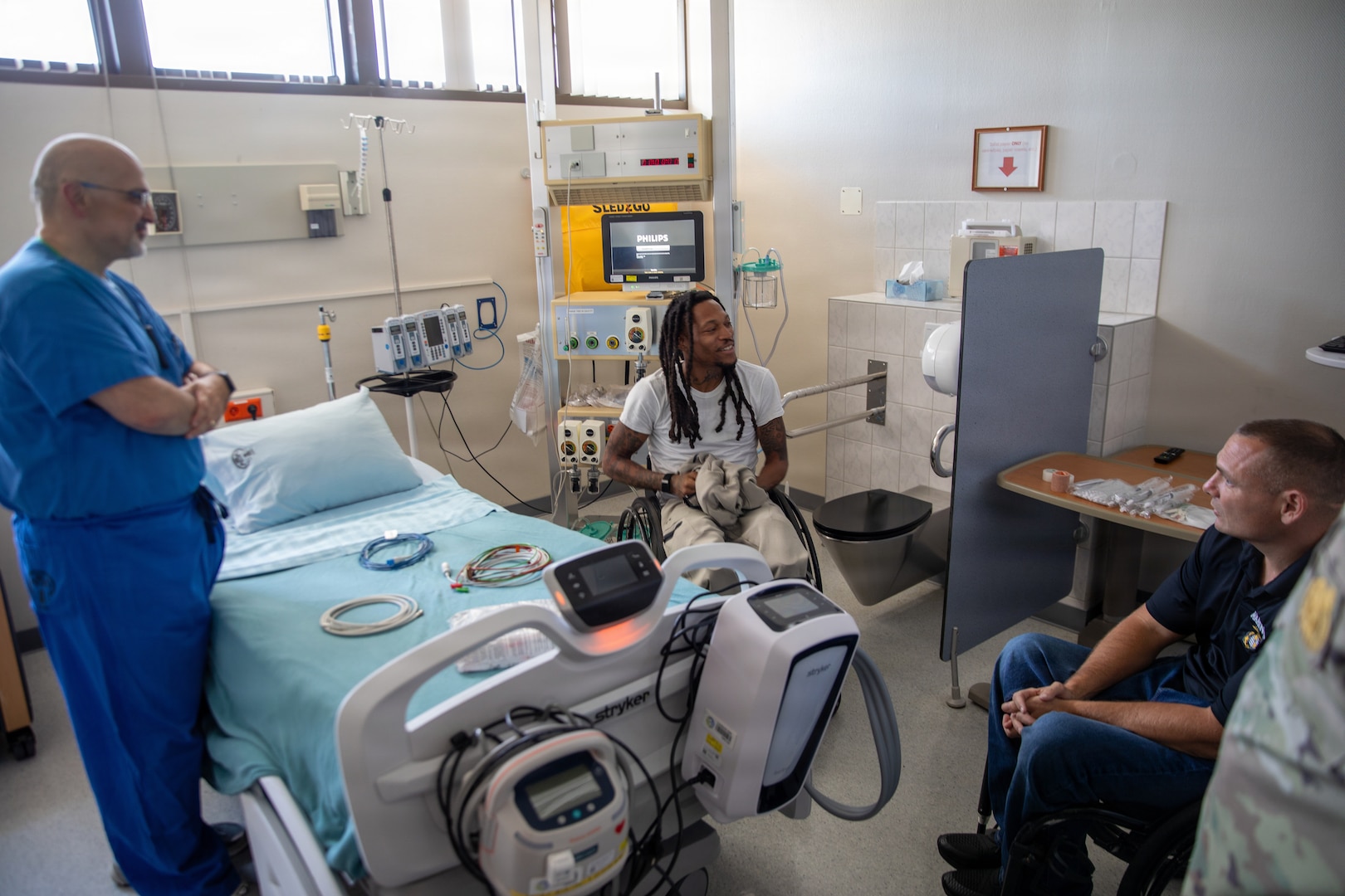 U.S. Marine Corps veterans Lance Cpl. Michael DeLancey and Sgt. Anthony McDaniel visit Landstuhl Regional Medical Center in Landstuhl, Germany, July 29, 2026. During their visit, the Marines met with LRMC staff and toured the medical center where they received care after sustaining combat injuries during military service overseas. The visit highlighted the lasting connection between wounded service members and the military medical professionals who supported their recovery.(DoD Photo by Travis Jones)
