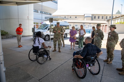 U.S. Marine Corps veterans Lance Cpl. Michael DeLancey and Sgt. Anthony McDaniel visit Landstuhl Regional Medical Center in Landstuhl, Germany, July 29, 2026. During their visit, the Marines met with LRMC staff and toured the medical center where they received care after sustaining combat injuries during military service overseas. The visit highlighted the lasting connection between wounded service members and the military medical professionals who supported their recovery.(DoD Photo by Travis Jones)