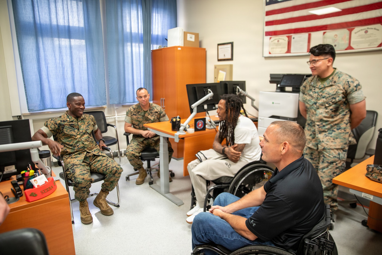 U.S. Marine Corps veterans Lance Cpl. Michael DeLancey and Sgt. Anthony McDaniel visit Landstuhl Regional Medical Center in Landstuhl, Germany, July 29, 2026. During their visit, the Marines met with LRMC staff and toured the medical center where they received care after sustaining combat injuries during military service overseas. The visit highlighted the lasting connection between wounded service members and the military medical professionals who supported their recovery.(DoD Photo by Travis Jones)