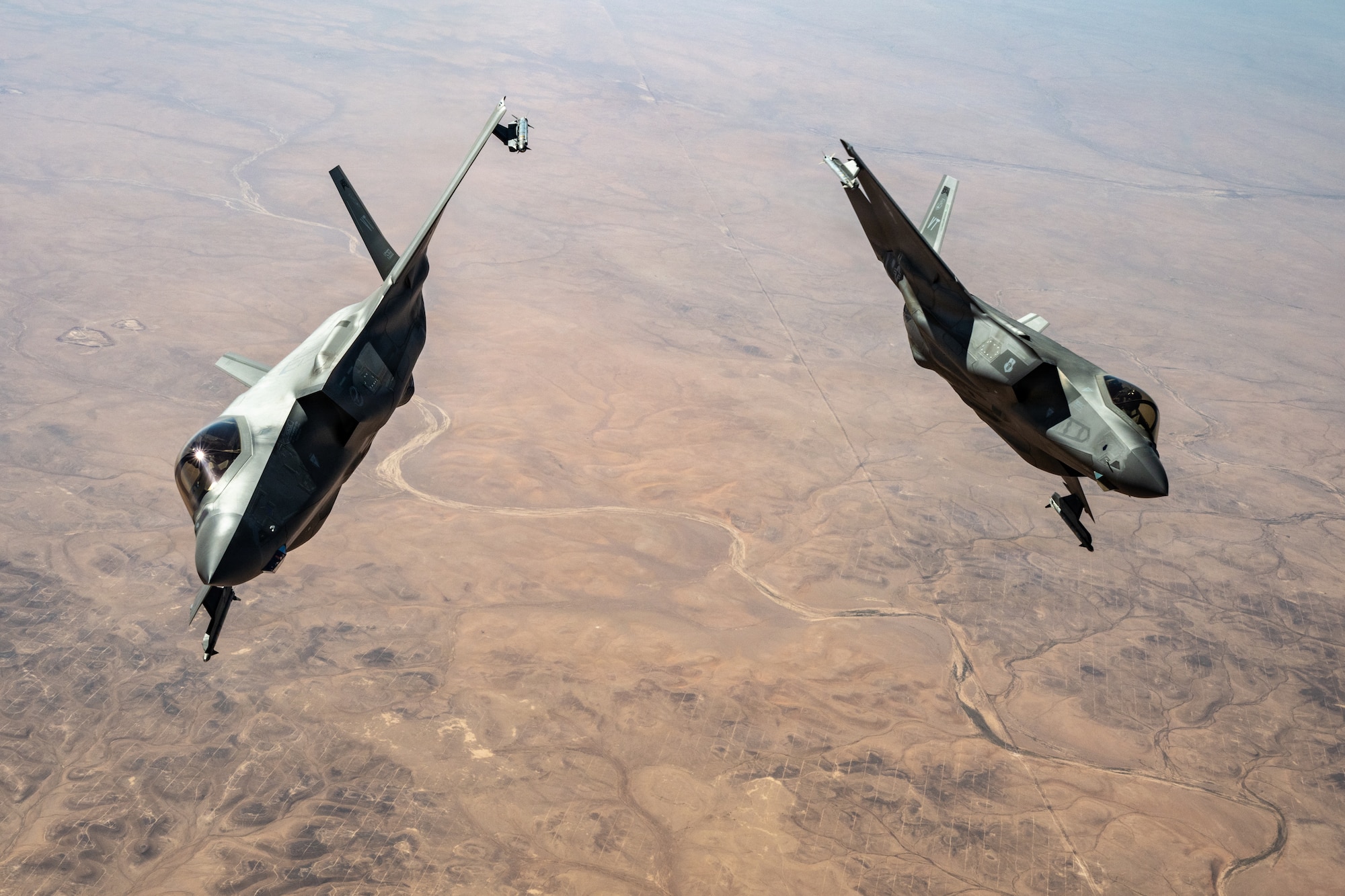 Two U.S. Air Force F-35A Lightning IIs fly in the U.S. Central Command area of responsibility July 2, 2026. The aircraft deliver advanced airpower capabilities that enhance combat readiness and support regional security. (U.S. Air Force photo by Tech. Sgt. Tiffany A. Emery)