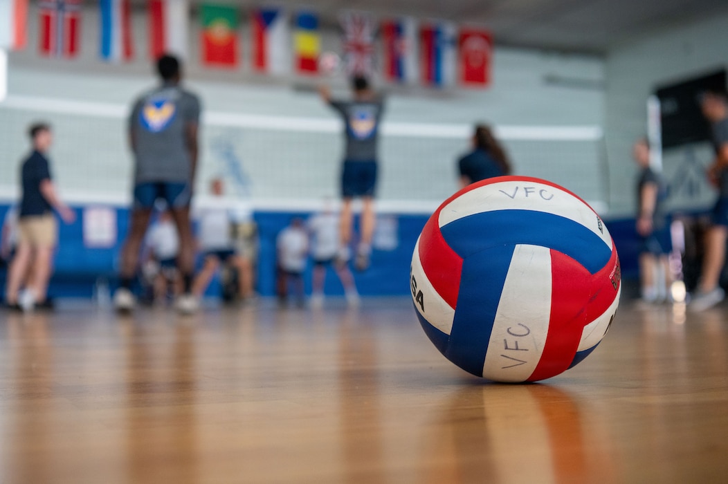 Airman Leadership School cadre compete against ALS students in a volleyball match.